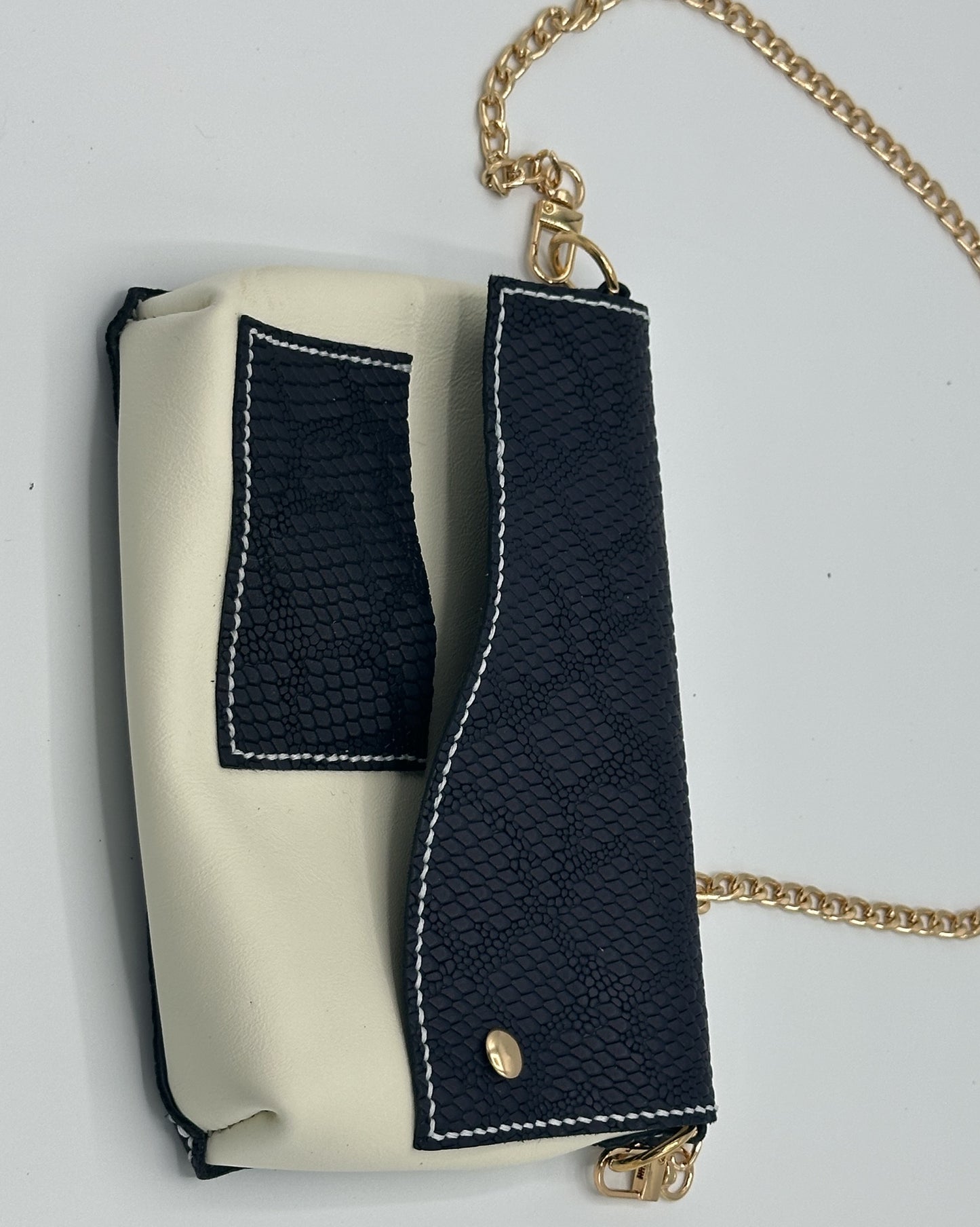 Off white and navy embossed snakeskin clutch