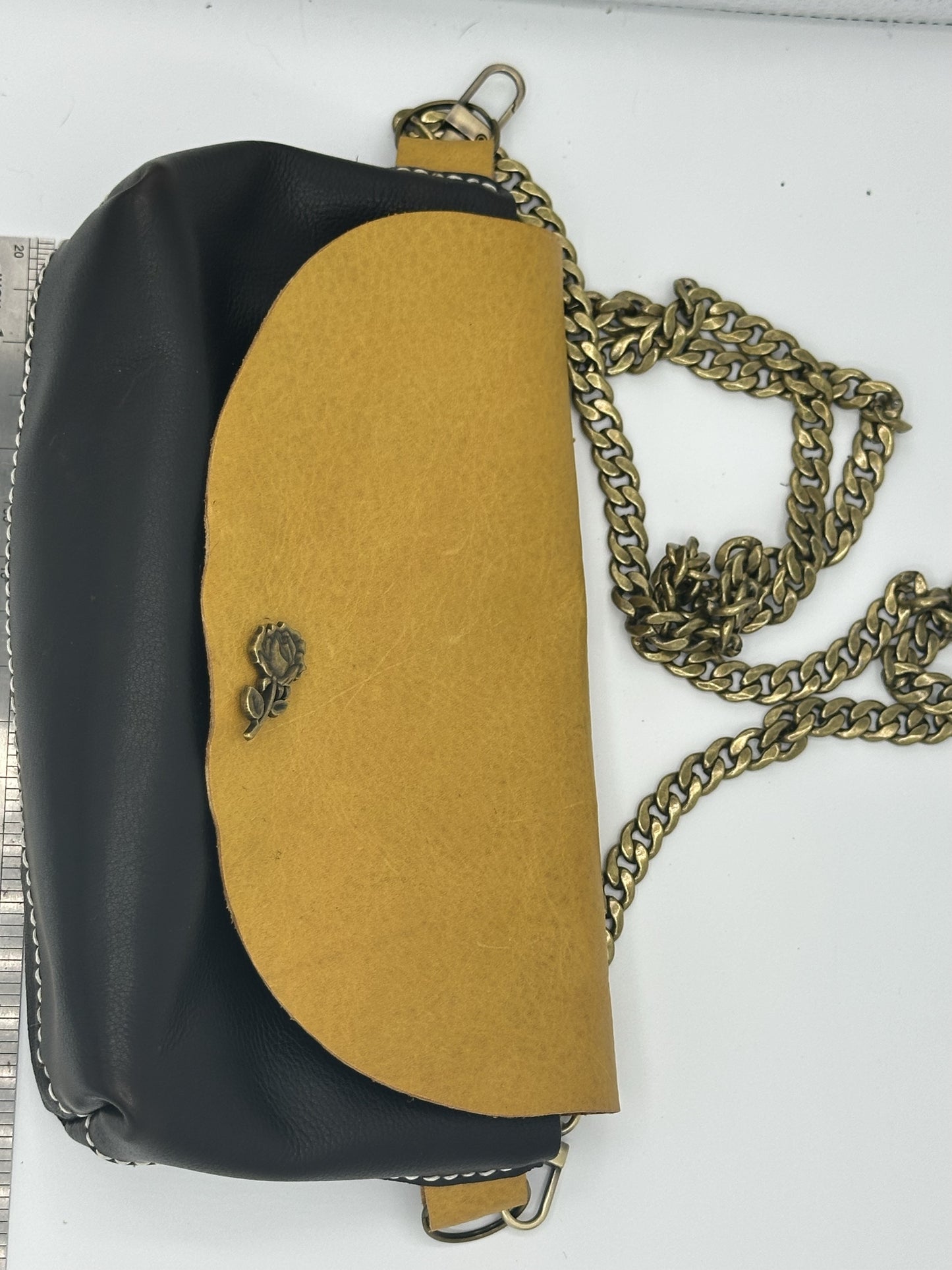 Camel and dark brown leather clutch