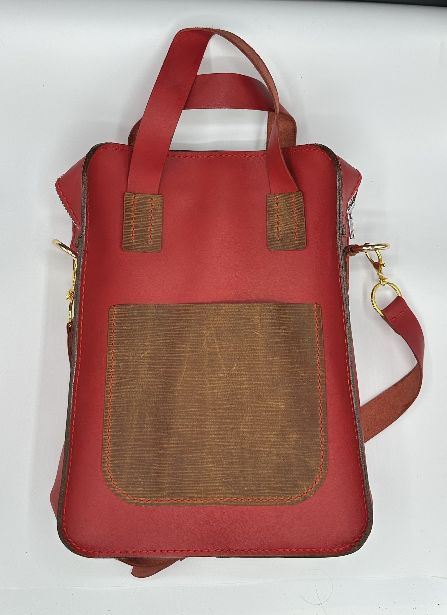 1000 line red and brown top grain leather bag
