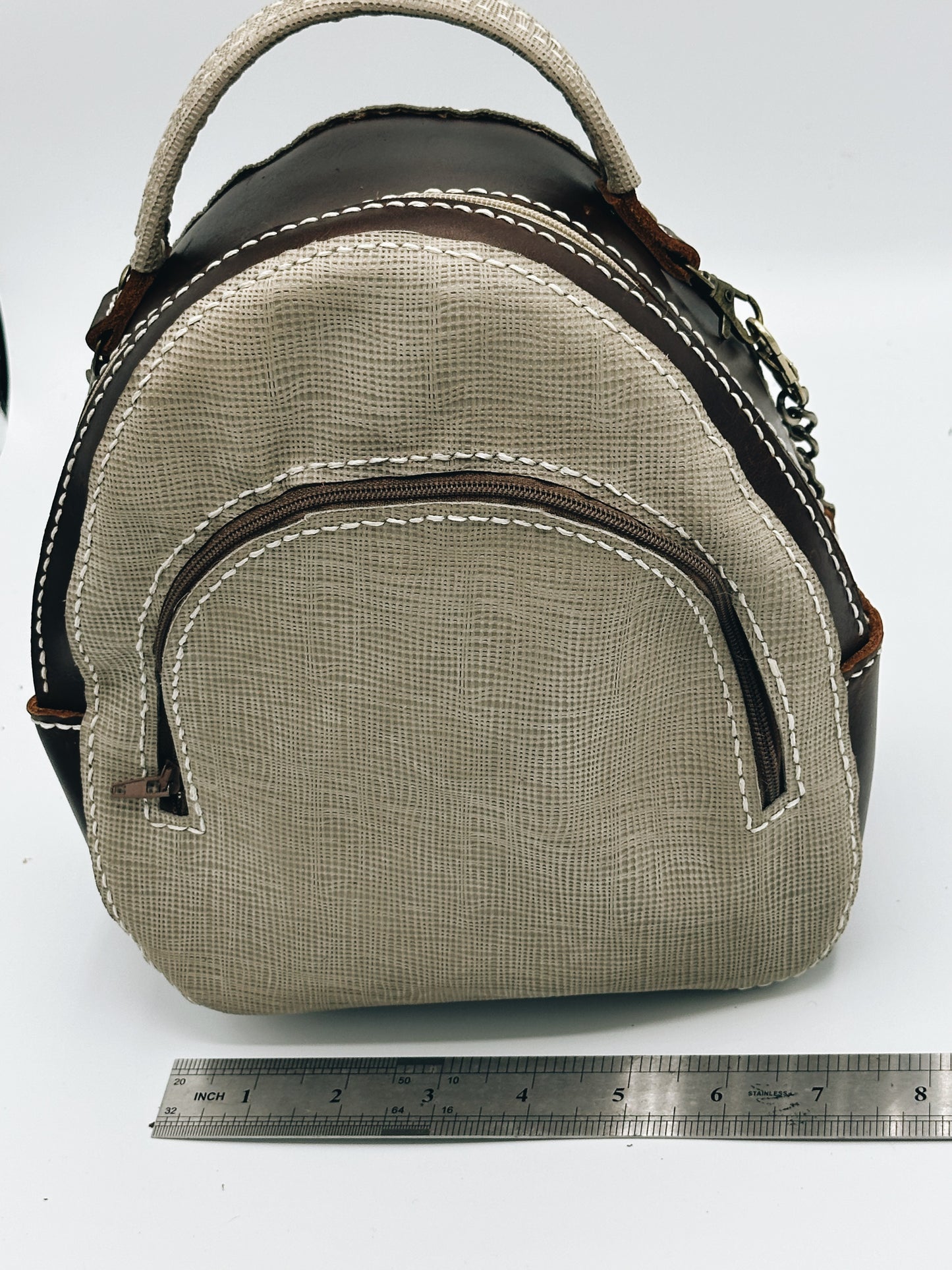 Brown and tan three pocket leather bag