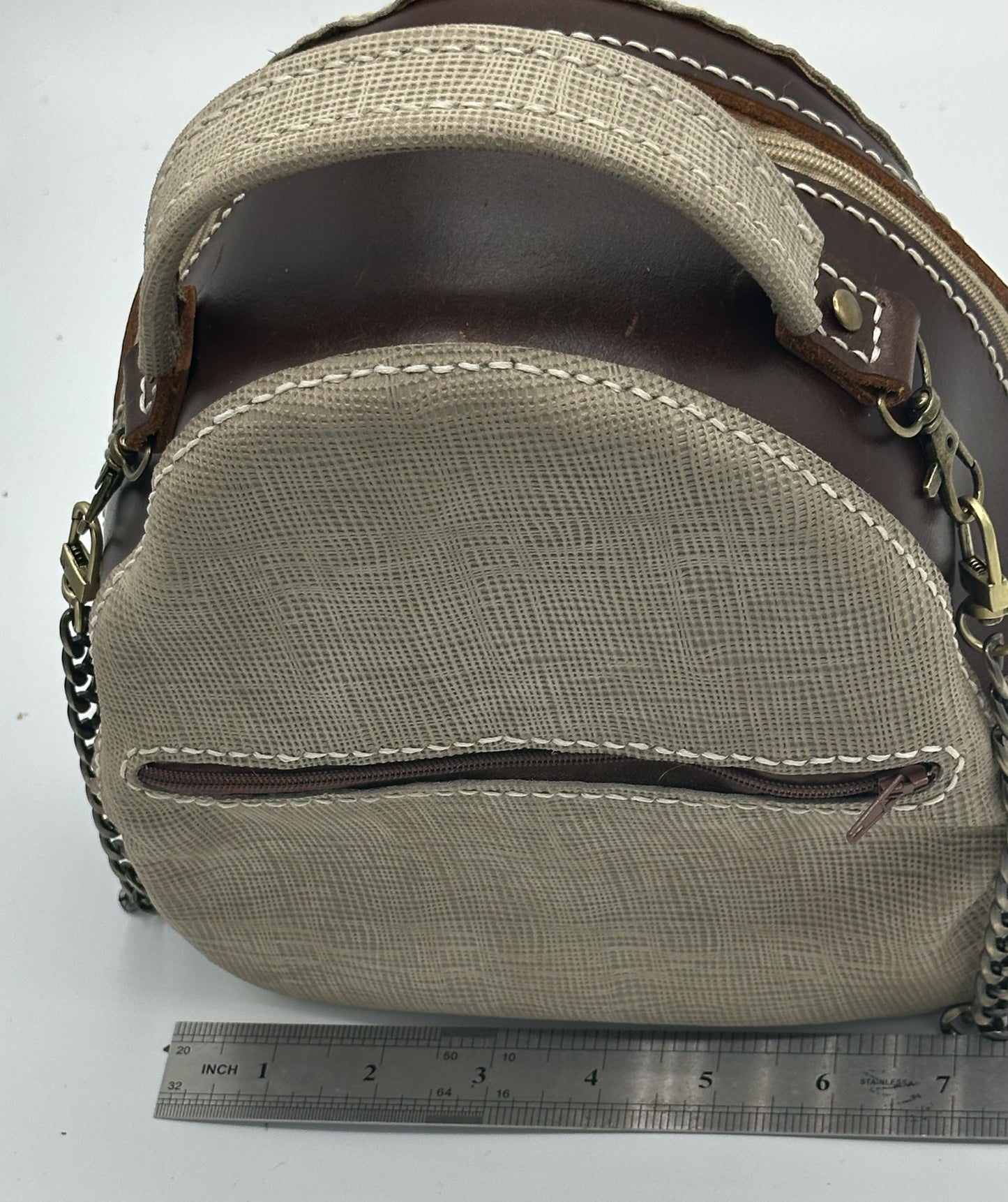 Brown and tan three pocket leather bag