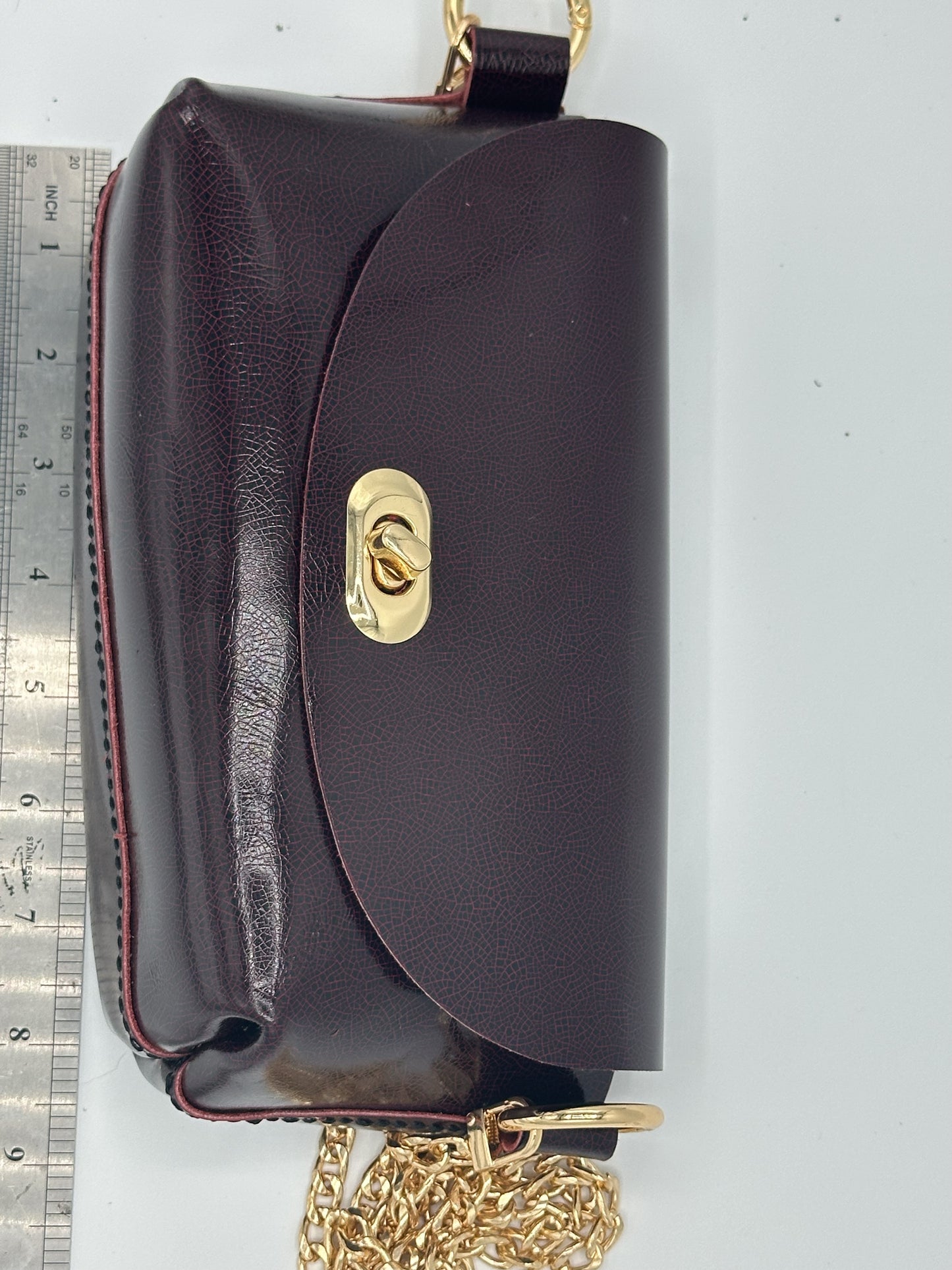 Burgundy leather clutch