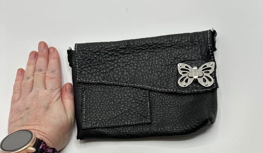 Black leather purse butterfly closure