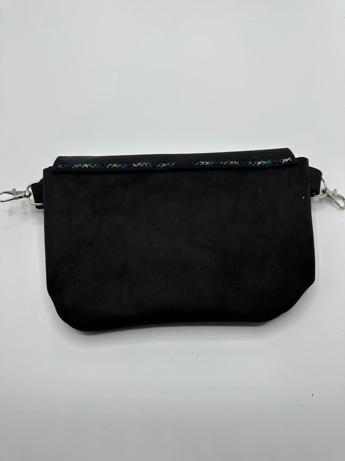 Black leather bag with blue, green, and silver painting